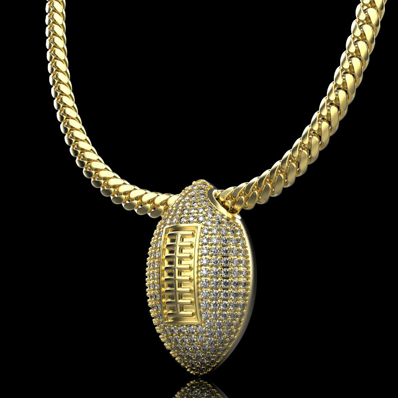Gold football necklace pendant with diamonds, by QJ Jewelry, on a black background