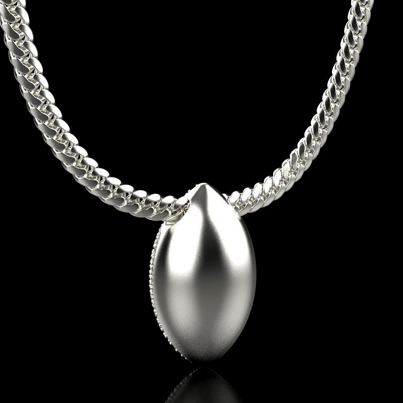Silver football necklace pendant with diamonds, by QJ Jewelry, on a black background