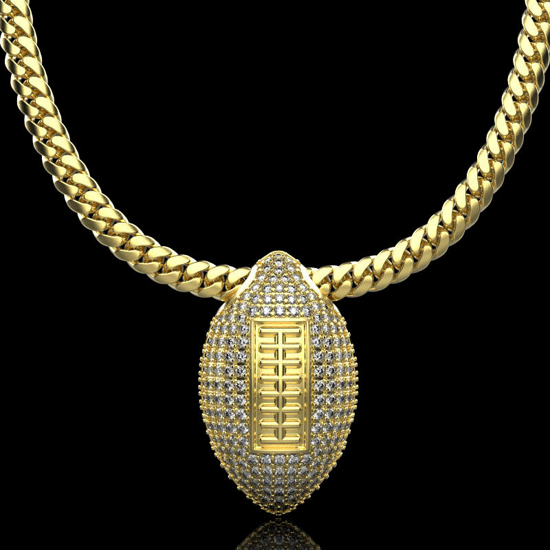 Gold football necklace pendant with diamonds, by QJ Jewelry, on a black background