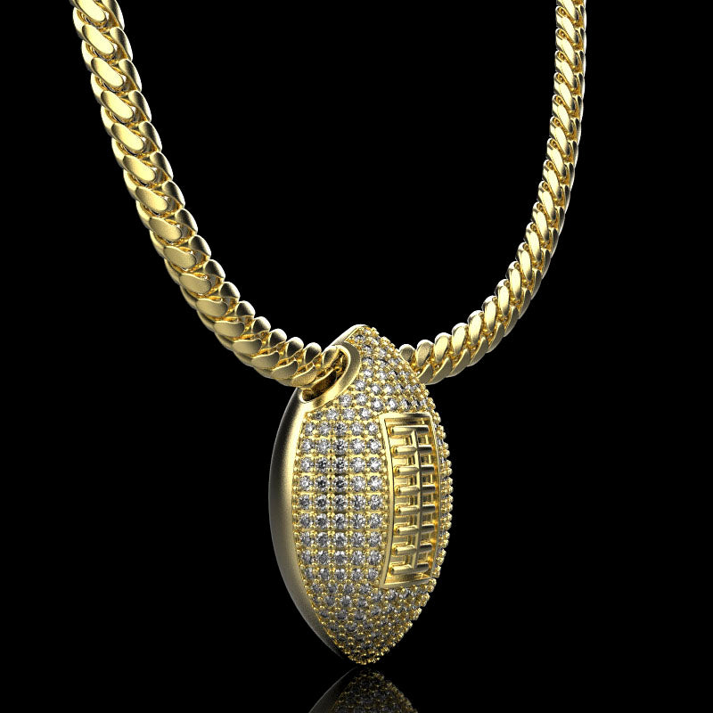 Gold football necklace pendant with diamonds, by QJ Jewelry, on a black background