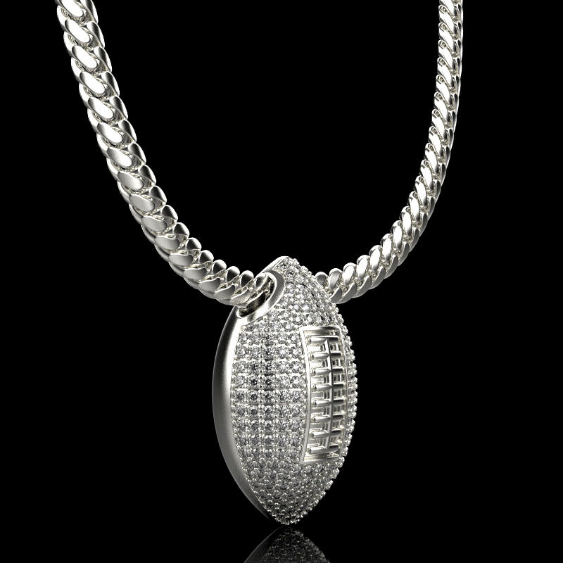 Silver football necklace pendant with diamonds, by QJ Jewelry, on a black background