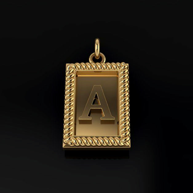 Gold pendant with letter 'A' on a black background