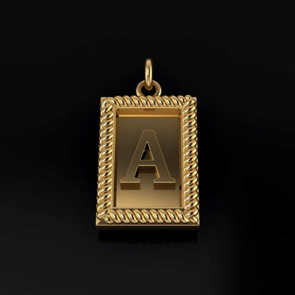 Gold pendant with letter 'A' on a black background